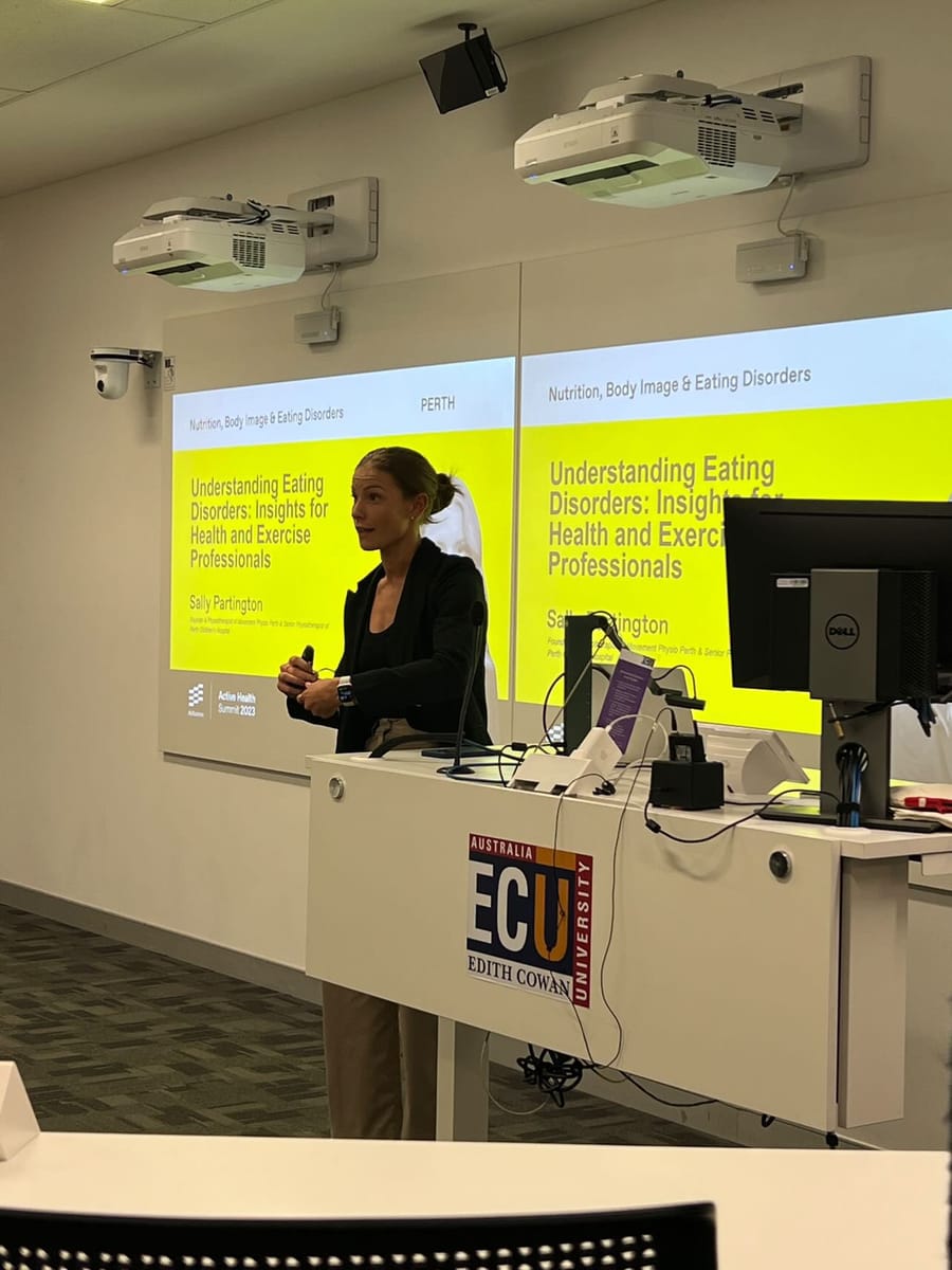Sally presenting at a lectern